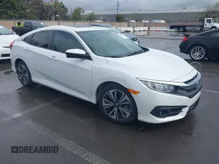 2017 Honda Civic EX-L z VIN 2HGFC1F79HH635156, wystawiony jako IAAI lot #41922115 z przebiegiem 142 565 mil mil oraz . Historia ofert i sprzedaży dostępna na DreamBid. Obrazek 1.
