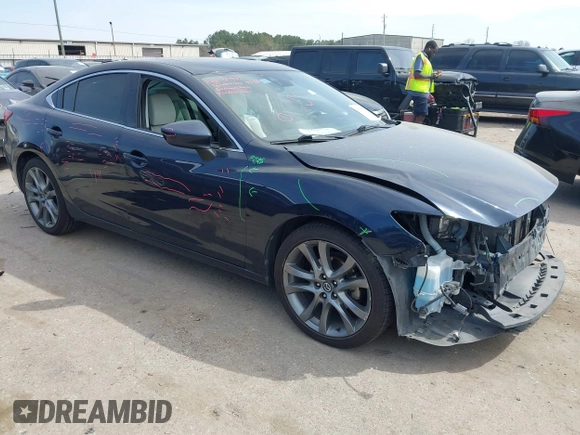 2016 Mazda 6 i Grand Touring with VIN JM1GJ1W59G1439075, listed as a IAAI auction lot 41792755 with 99,215 mi miles and . Bid and sale history available at DreamBid. Image 1.