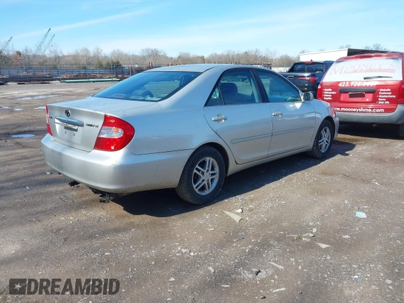 2002 Toyota Camry LE z VIN 4T1BE32K52U506649, wystawiony jako IAAI lot #41586416 z przebiegiem 312 245 mil mil oraz . Historia ofert i sprzedaży dostępna na DreamBid. Obrazek 4.