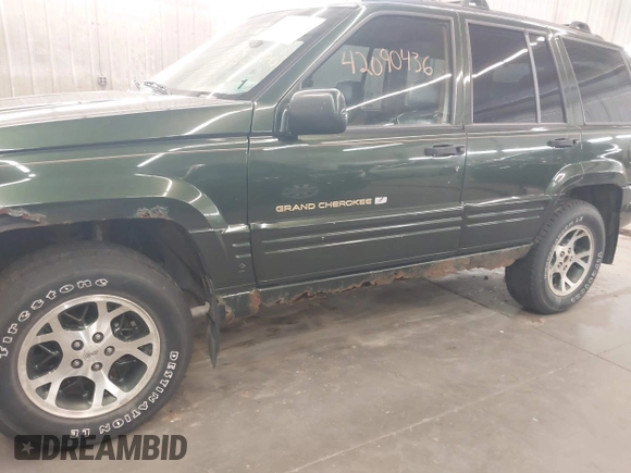 1997 Jeep Grand Cherokee Limited with VIN 1J4GZ78Y0VC684023, listed as a IAAI auction lot 42090436 with 310,831 mi miles. Bid and sale history available at carsss.com. Image 6.