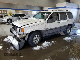 1993 Jeep Grand Cherokee Laredo with VIN 1J4GZ58Y2PC658787, listed as a Copart auction lot 41687765 with 166,262 mi miles and Salvage Title. Bid and sale history available at carsss.com. Image 1.