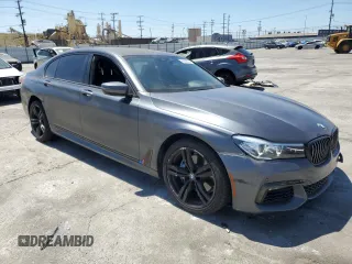 2018 BMW 7 Series 740i with VIN WBA7E2C59JG742809, listed as a Copart auction lot 66995934 with 62,017 mi miles and Salvage Title. Bid and sale history available at carsss.com. Image 4.