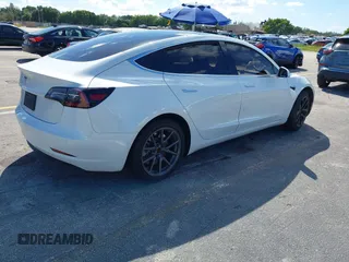 2020 Tesla Model 3 Standard Range Plus with VIN 5YJ3E1EA8LF783631, listed as a IAAI auction lot 40696383 with 78,889 mi miles. Bid and sale history available at carsss.com. Image 4.