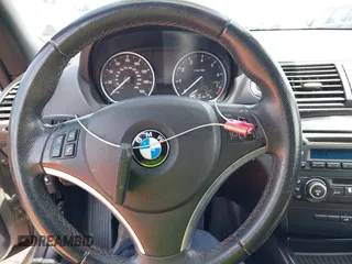 2011 BMW 1 Series 128i with VIN WBAUL7C5XBVE87044, listed as a IAAI auction lot 42095602 with 163,049 mi miles and . Bid and sale history available at carsss.com. Image 11.