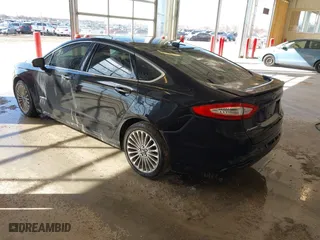 2014 Ford Fusion Titanium Hybrid with VIN 3FA6P0RU1ER290290, listed as a IAAI auction lot 41671735 with 207,405 mi miles. Bid and sale history available at carsss.com. Image 3.