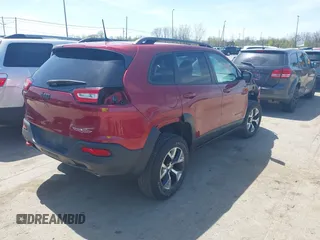 2016 Jeep Cherokee Trailhawk with VIN 1C4PJMBS9GW237059, listed as a IAAI auction lot 42079788 with 114,513 mi miles. Bid and sale history available at carsss.com. Image 4.
