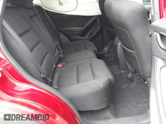 2016 Mazda CX-5 Touring z VIN JM3KE2CY3G0894441, wystawiony jako IAAI lot #41508767 z przebiegiem 88 554 mil mil oraz . Historia ofert i sprzedaży dostępna na DreamBid. Obrazek 8.