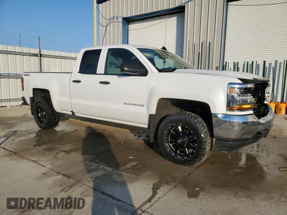 2017 Chevrolet Silverado 1500 Work Truck with VIN 1GCVKNEC6HZ125379, listed as a Copart auction lot 52095815 with 123,285 mi miles and Salvage Title. Bid and sale history available at DreamBid. Image 4.