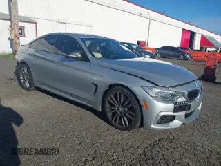 2015 BMW 4 Series 428i with VIN WBA4A5C58FG051293, listed as a IAAI auction lot 41255541 with 60,737 mi miles and . Bid and sale history available at carsss.com. Image 1.