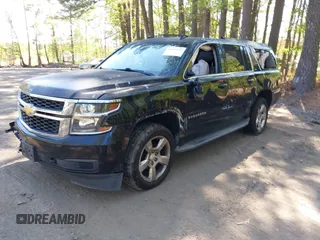 2015 Chevrolet Suburban LT with VIN 1GNSCJKC1FR264255, listed as a IAAI auction lot 42065176 with 115,861 mi miles. Bid and sale history available at carsss.com. Image 2.