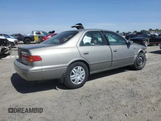 2001 Toyota Camry CE z VIN JT2BG22K410568101, wystawiony jako Copart lot #57184125 z przebiegiem Nie podano mil oraz Szkoda całkowita • Salvage title. Historia ofert i sprzedaży dostępna na DreamBid. Obrazek 3.