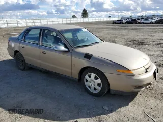 2000 Saturn LS z VIN 1G8JU52F0YY638148, wystawiony jako Copart lot #44614584 z przebiegiem 104 794 mil mil oraz Tytuł czysty. Historia ofert i sprzedaży dostępna na DreamBid. Obrazek 4.