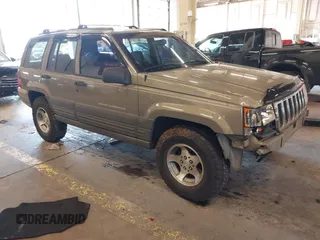 1996 Jeep Grand Cherokee Laredo with VIN 1J4GZ58S9TC293787, listed as a IAAI auction lot 41179368 with 141,755 mi miles. Bid and sale history available at carsss.com. Image 1.