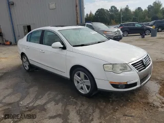 2009 Volkswagen Passat Sedan Komfort with VIN WVWJK73C59P025834, listed as a Copart auction lot 77911864 with 185,704 mi miles and Salvage Title. Bid and sale history available at carsss.com. Image 4.