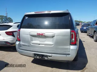 2015 GMC Yukon XL SLT with VIN 1GKS1HKC8FR221608, listed as a IAAI auction lot 42044318 with 215,757 mi miles. Bid and sale history available at carsss.com. Image 16.