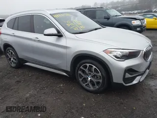 2021 BMW X1 xDrive28i with VIN WBXJG9C04M5T79810, listed as a IAAI auction lot 41471536 with 75,345 mi miles. Bid and sale history available at carsss.com. Image 1.