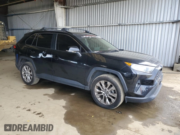 2019 Toyota RAV4 XLE Premium with VIN JTMA1RFV5KD026145, listed as a Copart auction lot 48238125 with 101,443 mi miles and Salvage Title. Bid and sale history available at carsss.com. Image 4.