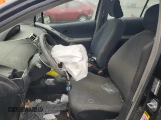 2009 Toyota Yaris with VIN JTDKT903095243922, listed as a Copart auction lot 51293545 with 196,909 mi miles and Salvage Title. Bid and sale history available at carsss.com. Image 7.