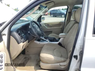 2006 Mazda Tribute S with VIN 4F2YZ04136KM18674, listed as a Copart auction lot 65126554 with 186,941 mi miles and Clean Title. Bid and sale history available at carsss.com. Image 7.