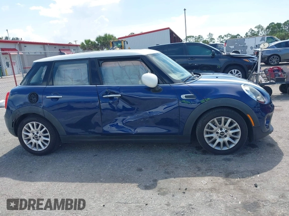 2015 MINI Hardtop 4 Door with VIN WMWXS5C51FT827510, listed as a IAAI auction lot 42365599 with 53,667 mi miles and . Bid and sale history available at DreamBid. Image 13.