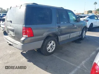 2003 Ford Expedition XLT Value with VIN 1FMPU16W43LA84570, listed as a IAAI auction lot 40937219 with 161,893 mi miles. Bid and sale history available at carsss.com. Image 4.