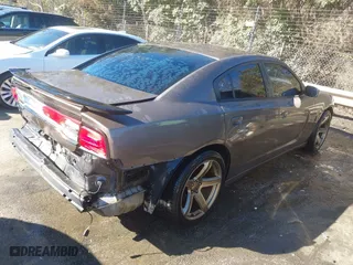 2013 Dodge Charger SE with VIN 2C3CDXBG2DH609438, listed as a IAAI auction lot 41649615 with 236,024 mi miles. Bid and sale history available at carsss.com. Image 4.