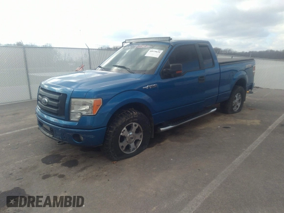 2009 Ford F-150 STX with VIN 1FTRX14849FA11909, listed as a IAAI auction lot 40979039 with 162,013 mi miles. Bid and sale history available at carsss.com. Image 2.