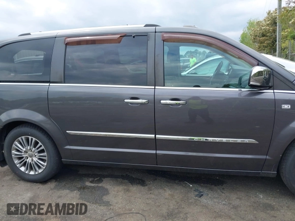 2014 Chrysler Town & Country Touring L with VIN 2C4RC1CG6ER195502, listed as a IAAI auction lot 42009629 with 126,157 mi miles and . Bid and sale history available at DreamBid. Image 13.