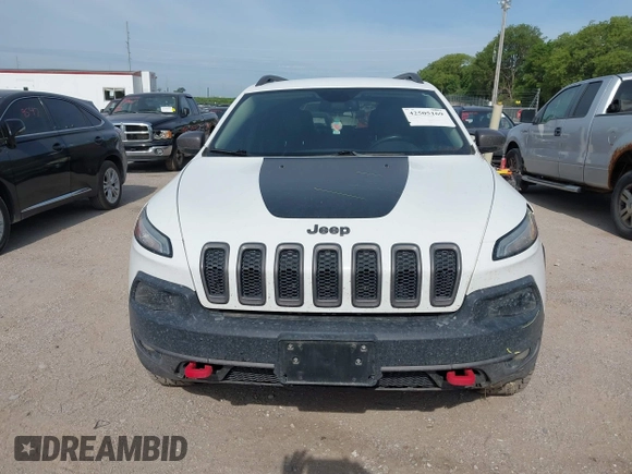 2015 Jeep Cherokee Trailhawk with VIN 1C4PJMBS6FW687718, listed as a IAAI auction lot 42505169 with 122,526 mi miles and . Bid and sale history available at DreamBid. Image 13.