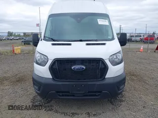 2024 Ford Transit Cargo z VIN 1FTBR3U86RKA14633, wystawiony jako IAAI lot #42500581 z przebiegiem 16 529 mil mil oraz . Historia ofert i sprzedaży dostępna na DreamBid. Obrazek 12.