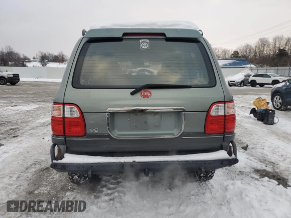 2002 Lexus LX 470 z VIN JTJHT00W923514121, wystawiony jako Copart lot #87761105 z przebiegiem 247 752 mil mil oraz Szkody całkowita. Historia ofert i sprzedaży dostępna na DreamBid. Obrazek 6.
