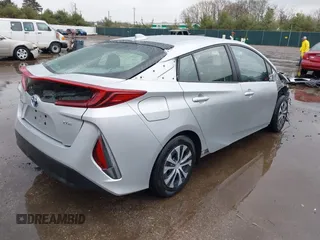 2021 Toyota Prius LE with VIN JTDKAMFP9M3170928, listed as a IAAI auction lot 42123934 with 58,293 mi miles and . Bid and sale history available at DreamBid. Image 4.