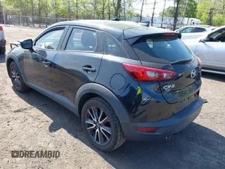 2018 Mazda CX-3 Touring z VIN JM1DKDC70J0329410, wystawiony jako IAAI lot #42137391 z przebiegiem 86 013 mil mil oraz . Historia ofert i sprzedaży dostępna na DreamBid. Obrazek 3.