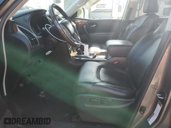 2016 Infiniti QX80 with VIN JN8AZ2NEXG9125687, listed as a Copart auction lot 52184535 with 149,495 mi miles and Salvage title. Bid and sale history available at DreamBid. Image 7.