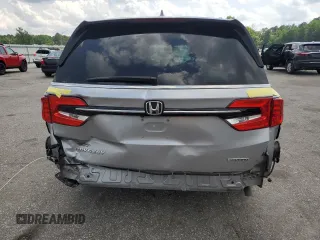 2021 Honda Odyssey Touring z VIN 5FNRL6H85MB039444, wystawiony jako Copart lot #57142205 z przebiegiem 74 228 mil mil oraz Szkoda całkowita • Salvage title. Historia ofert i sprzedaży dostępna na DreamBid. Obrazek 6.