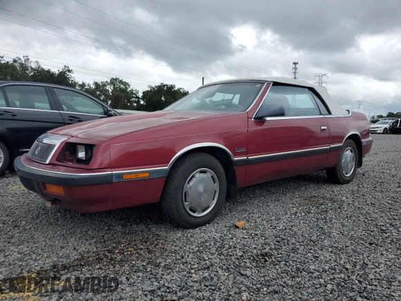 1989 Chrysler LeBaron z VIN 1C3XJ45J8KG223051, wystawiony jako Copart lot #75115464 z przebiegiem 27 923 mil mil oraz Szkody całkowita. Historia ofert i sprzedaży dostępna na DreamBid. Obrazek 1.
