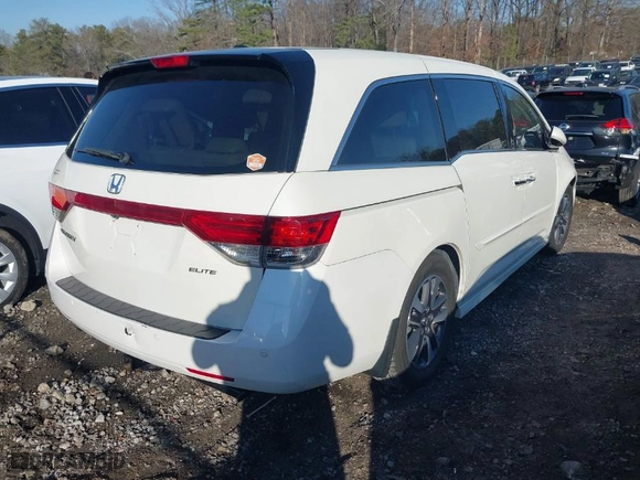 2015 Honda Odyssey Touring Elite with VIN 5FNRL5H90FB001643, listed as a IAAI auction lot 41487890 with NaN miles. Bid and sale history available at carsss.com. Image 4.