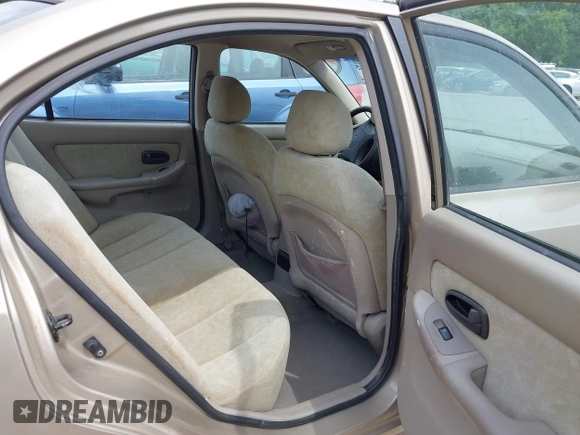 2003 Hyundai Elantra GLS z VIN KMHDN45D73U556305, wystawiony jako IAAI lot #42478211 z przebiegiem 149 648 mil mil oraz . Historia ofert i sprzedaży dostępna na DreamBid. Obrazek 8.