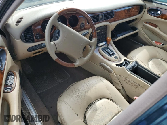 1999 Jaguar XJ with VIN SAJKX6047XC861227, listed as a Copart auction lot 75007414 with Not provided miles and Salvage title. Bid and sale history available at DreamBid. Image 8.