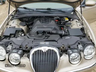 2003 Jaguar S-Type z VIN SAJEA01U33HM71782, wystawiony jako Copart lot #82969304 z przebiegiem 127 176 mil mil oraz Szkody całkowita. Historia ofert i sprzedaży dostępna na DreamBid. Obrazek 13.