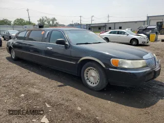 1999 Lincoln Town Car Executive with VIN 1L1FM81W8XY710157, listed as a Copart auction lot 59804965 with Not provided miles and Salvage title. Bid and sale history available at DreamBid. Image 4.