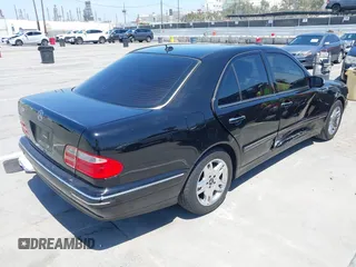 2002 Mercedes-Benz E-Class with VIN WDBJF65J62B404868, listed as a IAAI auction lot 42121837 with 107,415 mi miles. Bid and sale history available at carsss.com. Image 4.