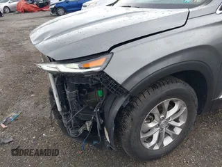 2019 Hyundai Santa Fe SEL z VIN 5NMS3CAD7KH035429, wystawiony jako IAAI lot #42323641 z przebiegiem 60 909 mil mil oraz . Historia ofert i sprzedaży dostępna na DreamBid. Obrazek 22.