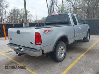 2003 Ford F-150 XL with VIN 1FTRX18L13NA95540, listed as a IAAI auction lot 41879632 with 1 mi miles. Bid and sale history available at carsss.com. Image 4.