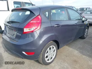 2013 Ford Fiesta SE with VIN 3FADP4EJ6DM205708, listed as a IAAI auction lot 42051721 with 139,143 mi miles. Bid and sale history available at carsss.com. Image 4.