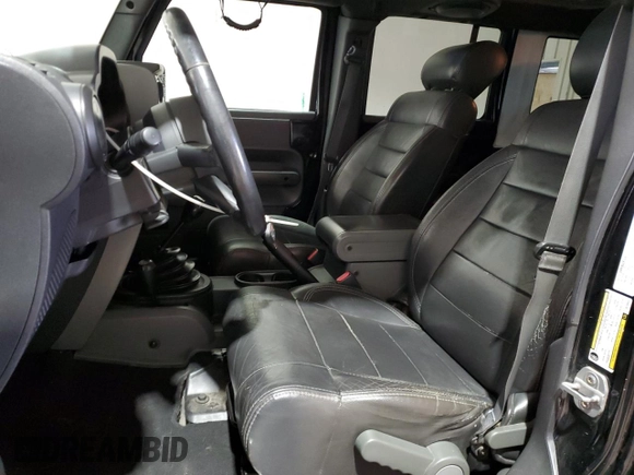 2009 Jeep Wrangler Unlimited Rubicon with VIN 1J8GA69179L756441, listed as a Copart auction lot 52111435 with 157,818 mi miles and Salvage title. Bid and sale history available at DreamBid. Image 7.