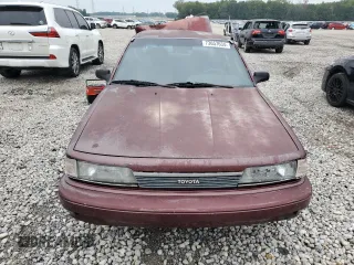 1989 Toyota Camry DLX z VIN 4T1SV21E1KU108151, wystawiony jako Copart lot #73657634 z przebiegiem 347 186 mil mil oraz Nie do naprawy • Non repairable. Historia ofert i sprzedaży dostępna na DreamBid. Obrazek 5.