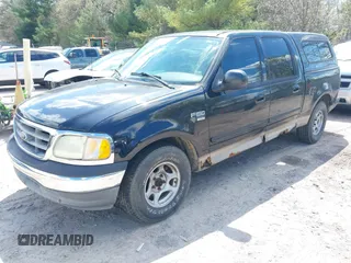 2003 Ford F-150 XLT with VIN 1FTRW07613KC71609, listed as a IAAI auction lot 42186741 with 190,591 mi miles. Bid and sale history available at carsss.com. Image 2.