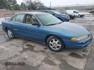 1999 Oldsmobile Intrigue GX z VIN 1G3WH52H0XF388437, wystawiony jako IAAI lot #41631925 z przebiegiem 129 236 mil mil oraz . Historia ofert i sprzedaży dostępna na DreamBid. Obrazek 1.