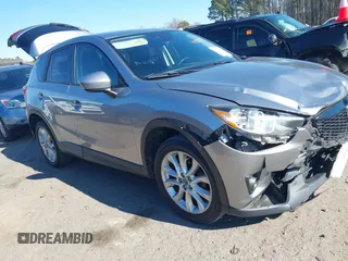 2014 Mazda CX-5 Grand Touring with VIN JM3KE4DY4E0388771, listed as a IAAI auction lot 41334877 with 157,830 mi miles. Bid and sale history available at carsss.com. Image 1.
